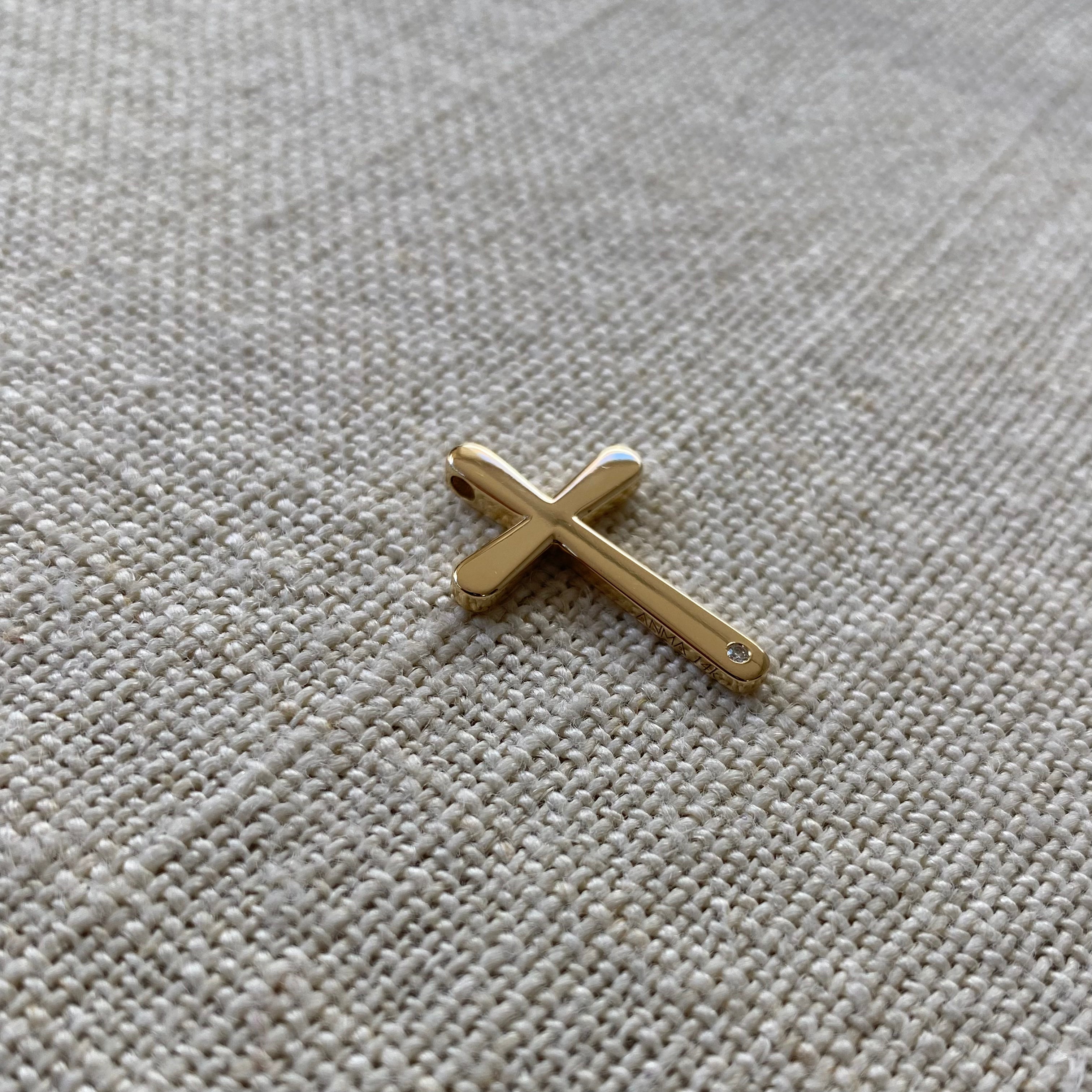 Bold, Curved Edges Gold Cross Pendant with a Diamond