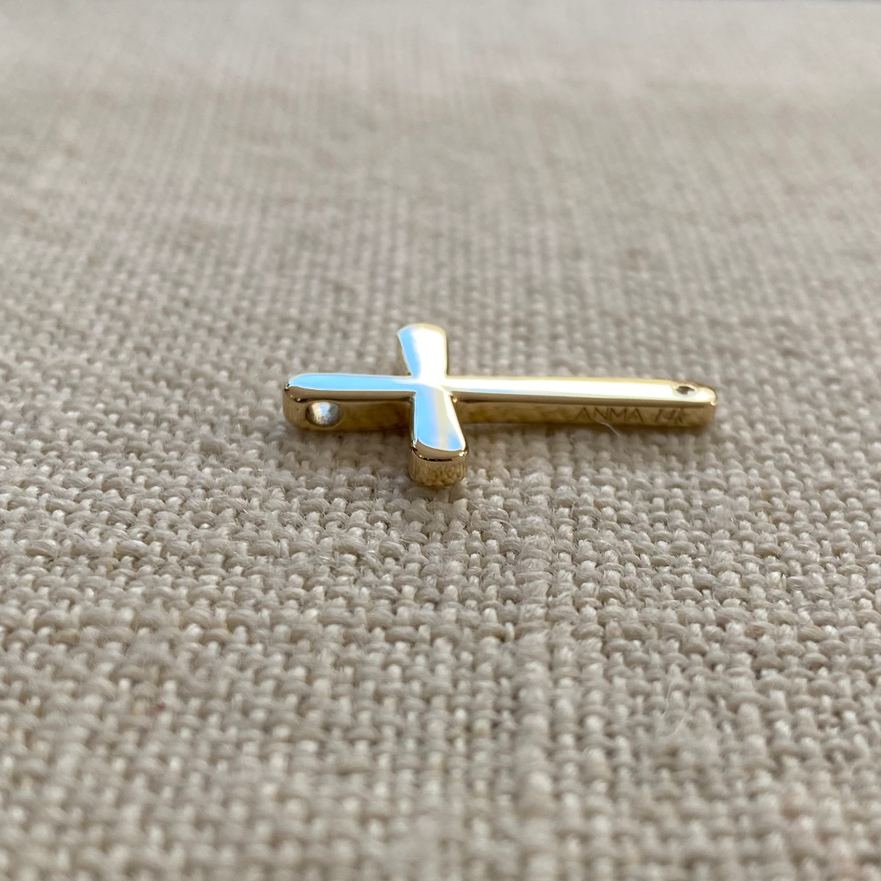 Bold, Curved Edges Gold Cross Pendant with a Diamond