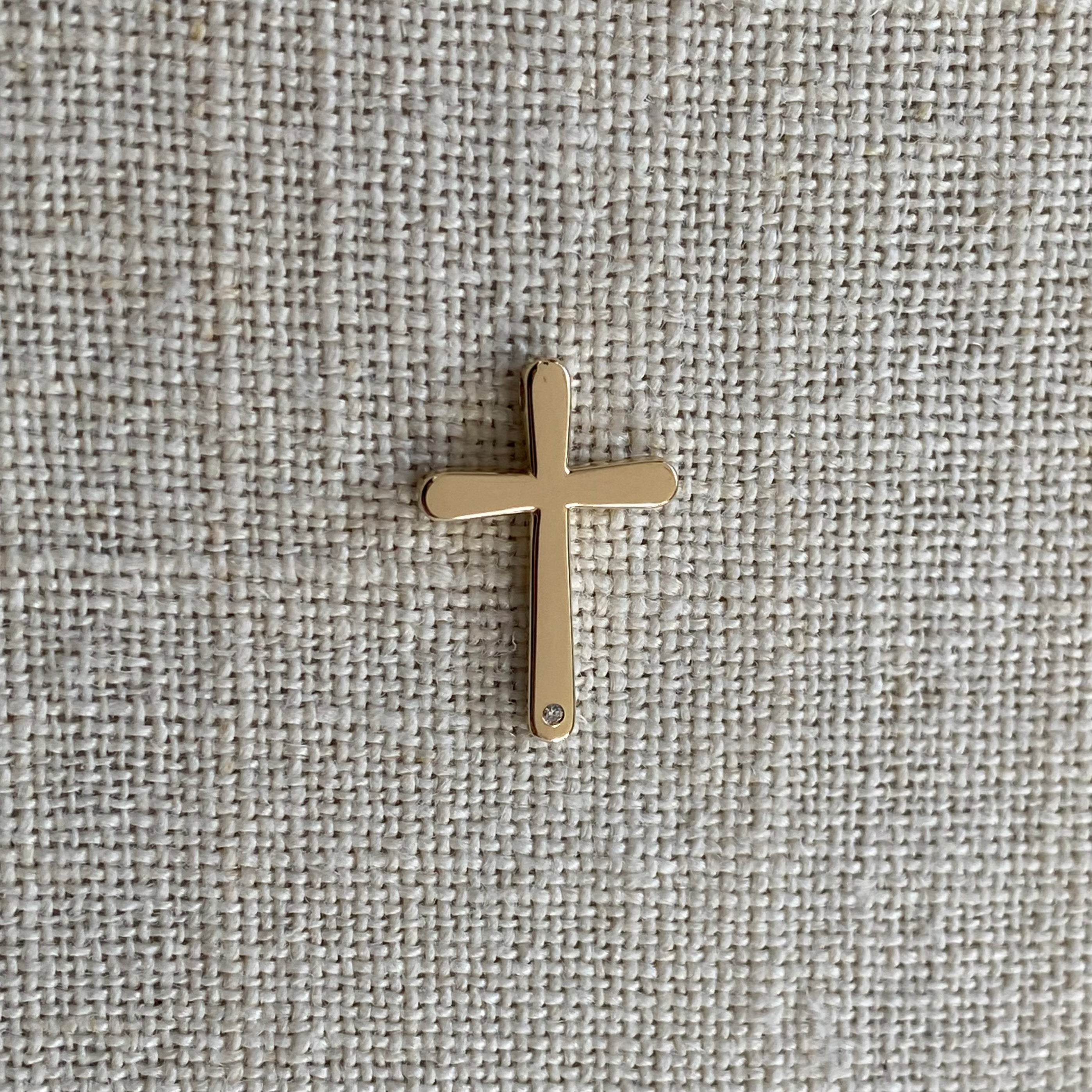 Bold, Curved Edges Gold Cross Pendant with a Diamond