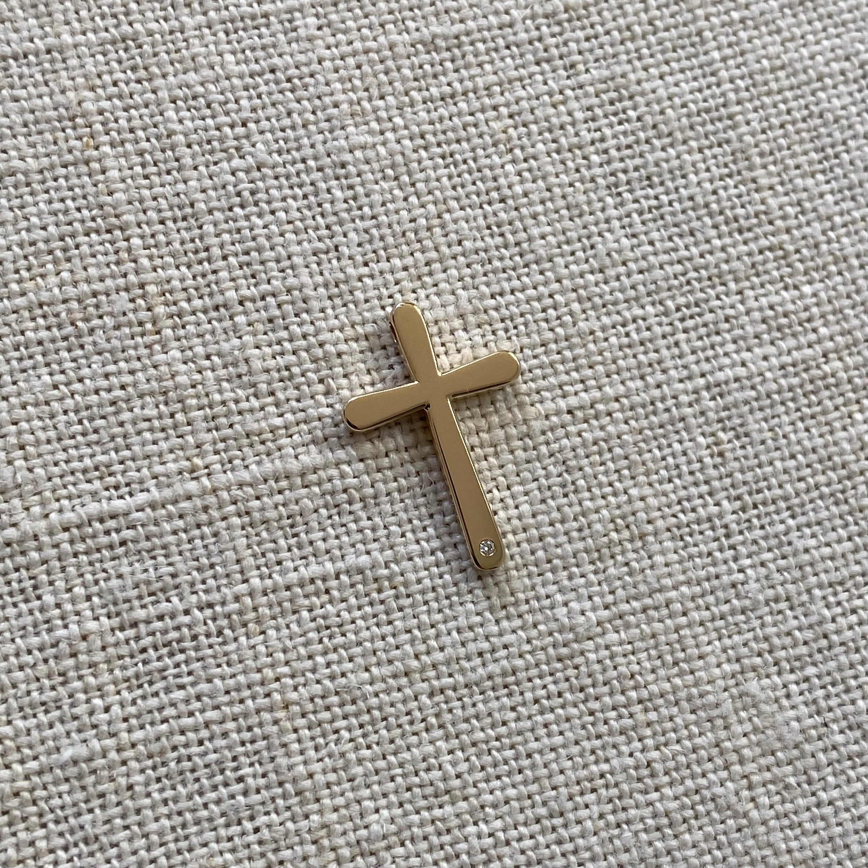 Bold, Curved Edges Gold Cross Pendant with a Diamond