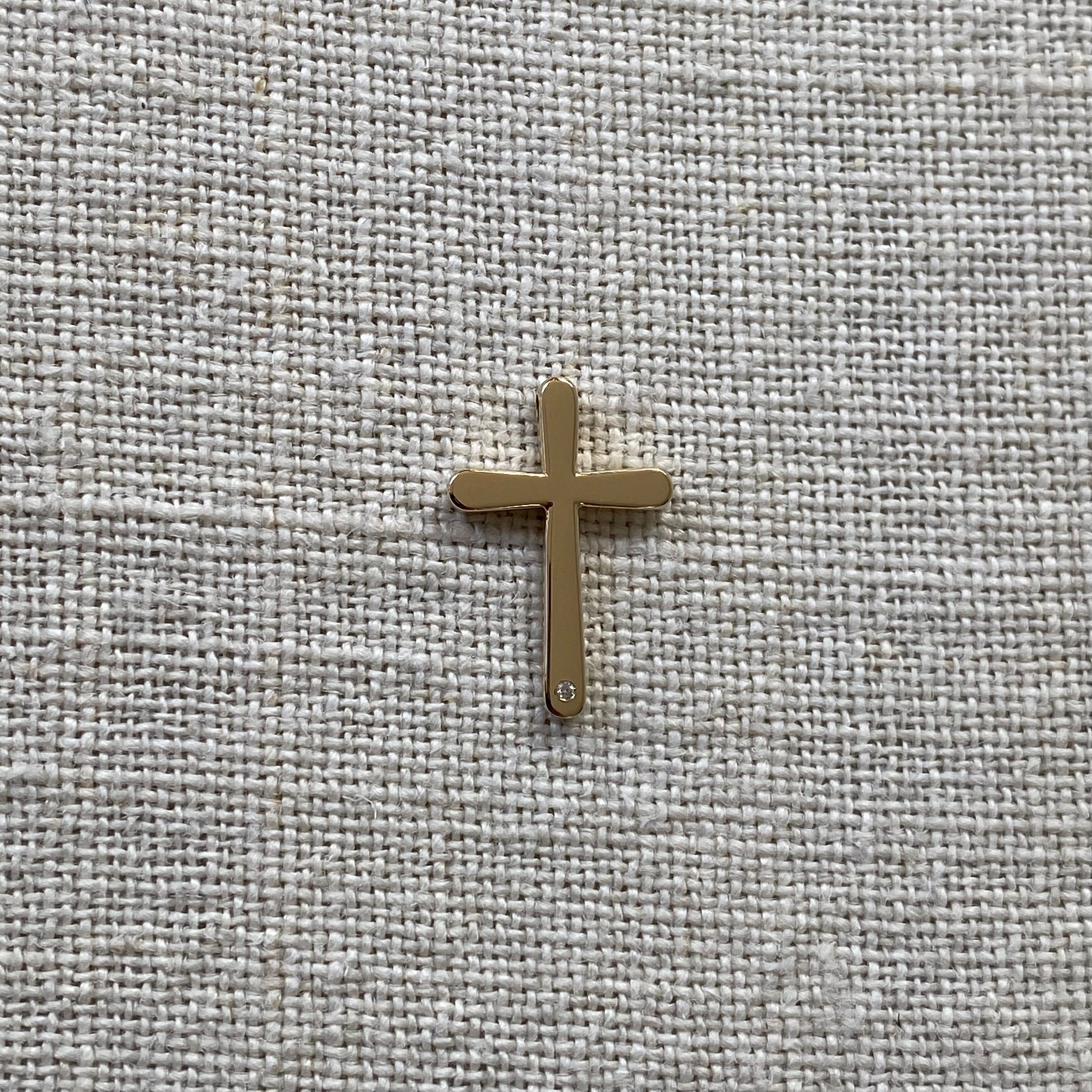 Bold, Curved Edges Gold Cross Pendant with a Diamond