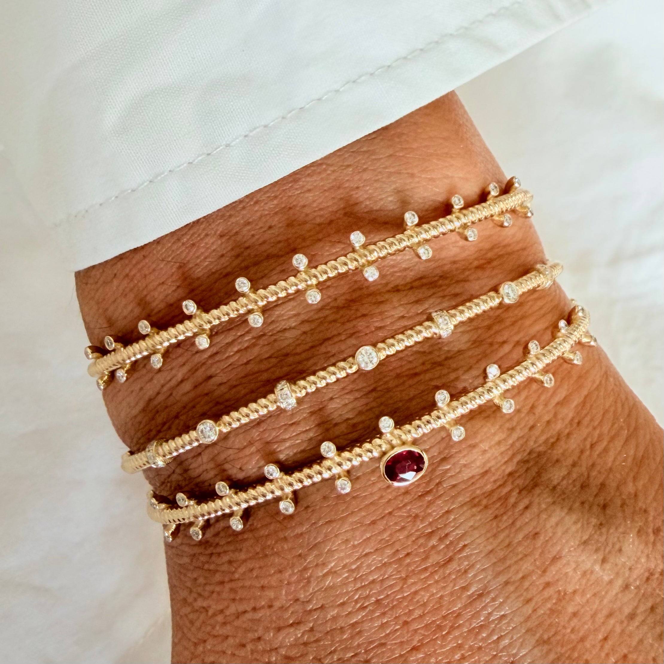 14K Gold Twisted Bracelet with Diamonds and Ruby