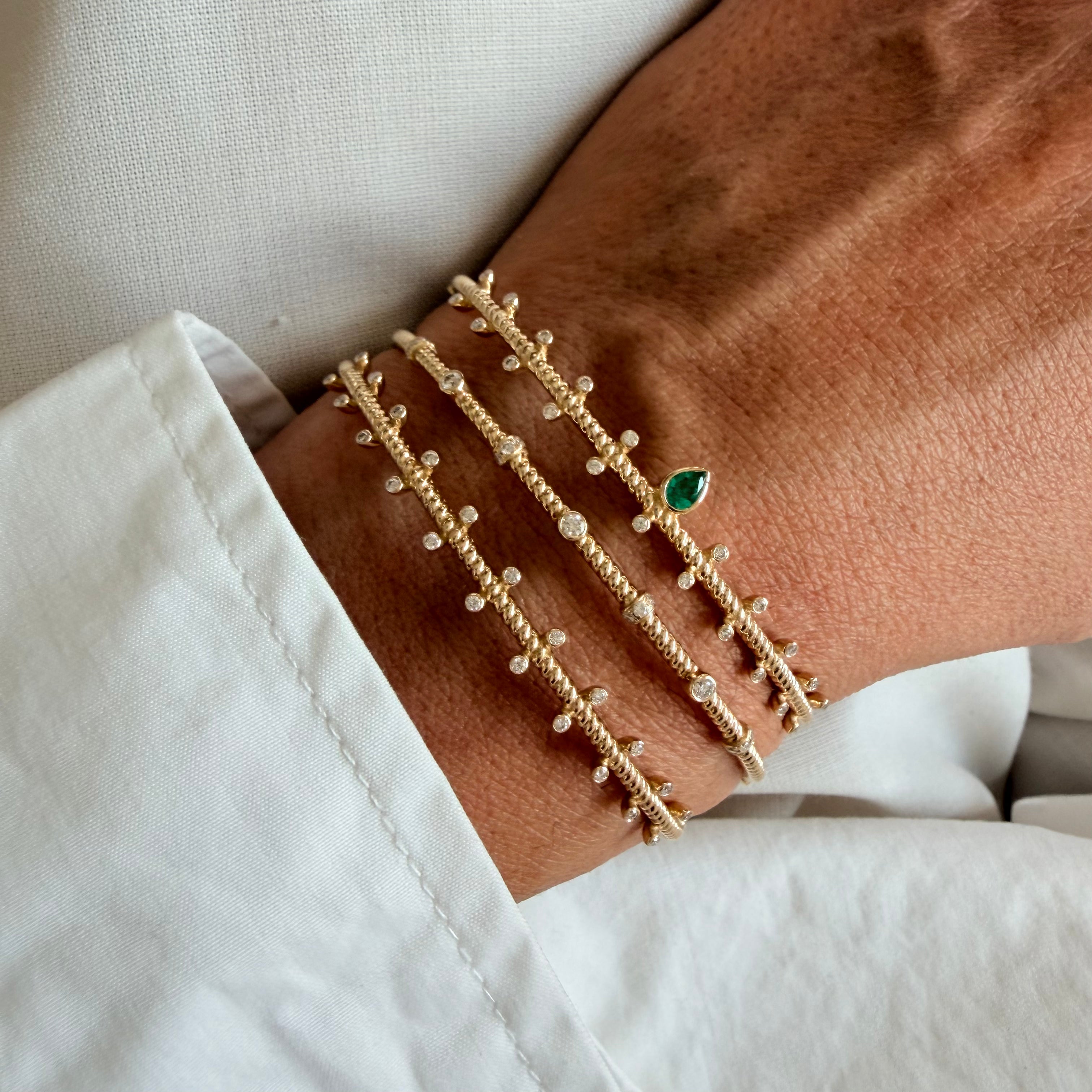 14K Gold Twisted Bracelet with Diamonds and Emerald