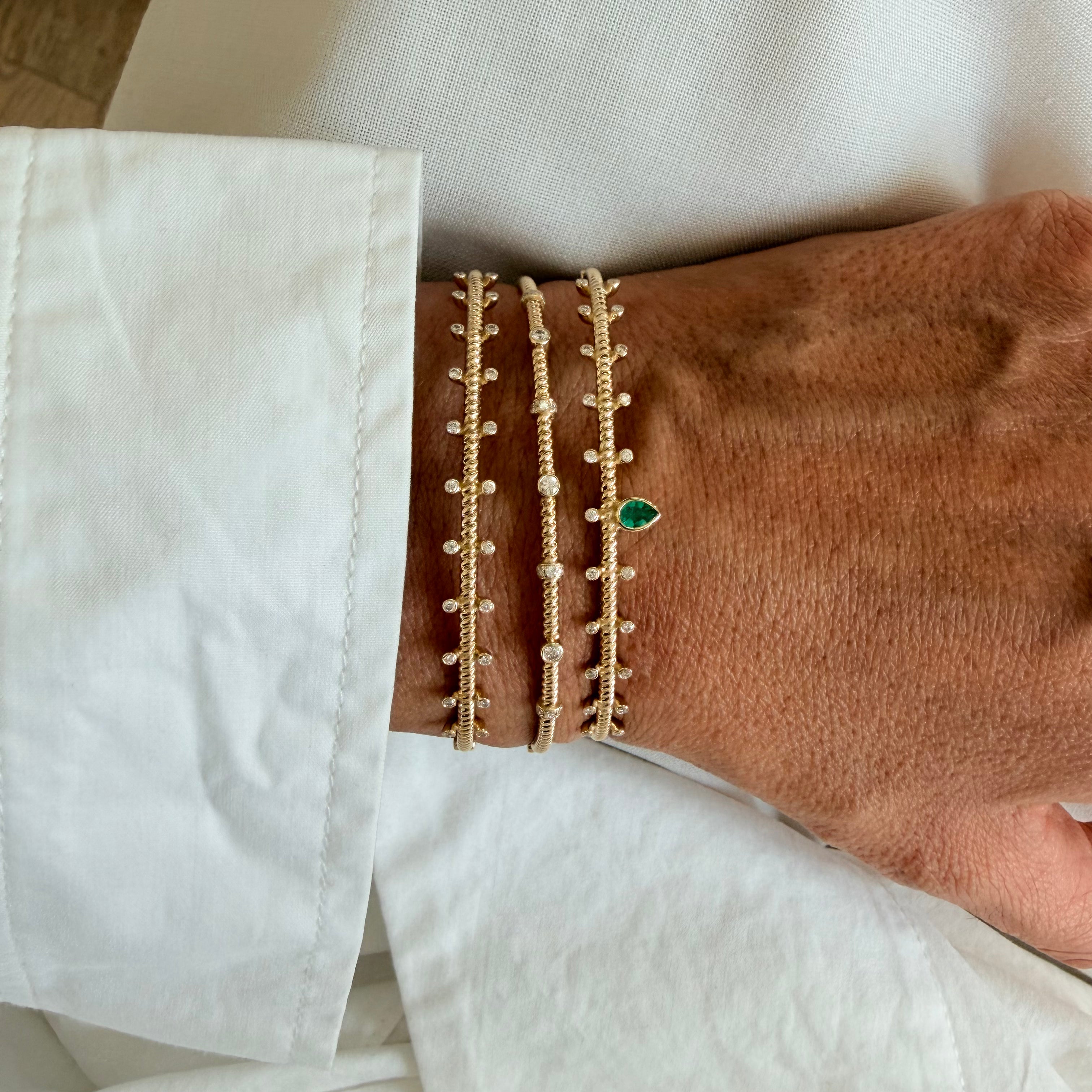 14K Gold Twisted Bracelet with Diamonds and Emerald